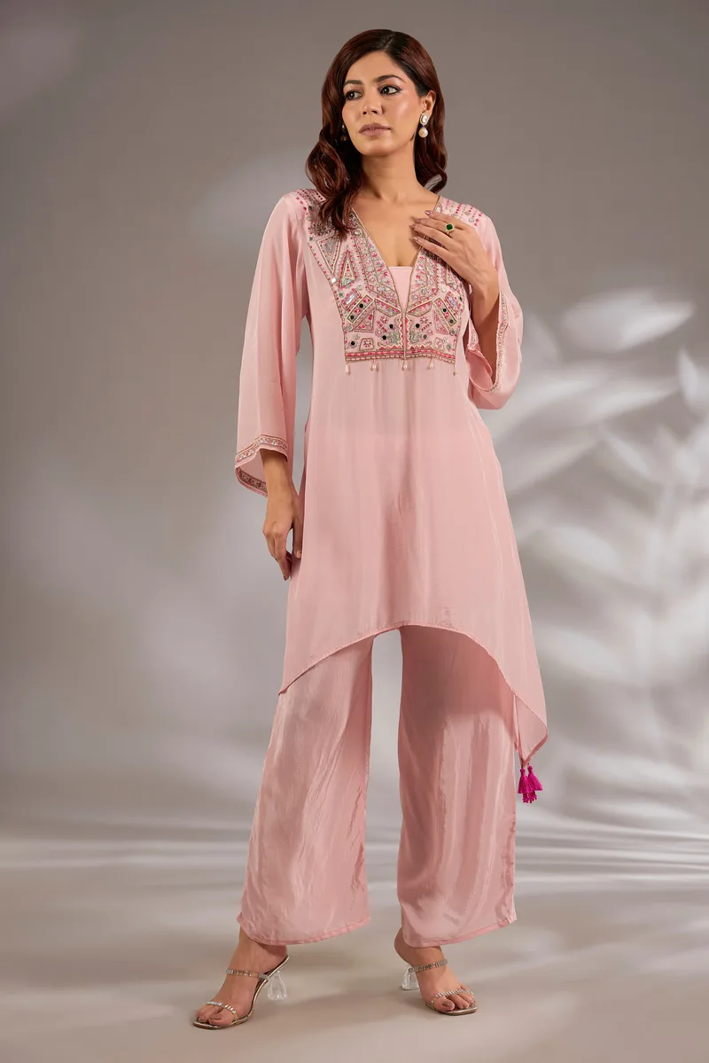 Kurta in crepe base with thread, cutdana and mirror embroidery.